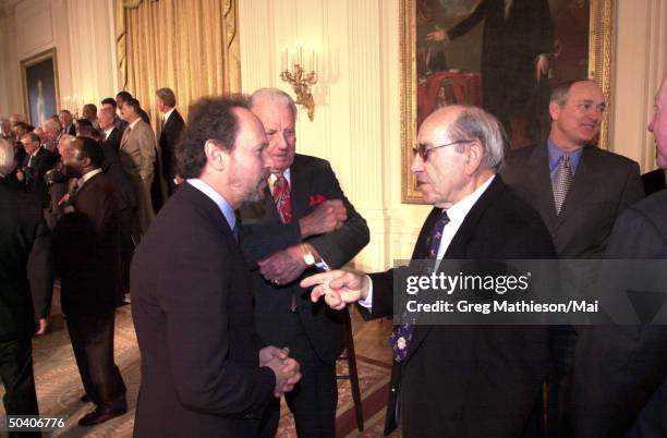 Actor and comedian Billy Crystal talking w. Baseball great Yogi Berra at President George W. Bush's reception in the East Room of the White House