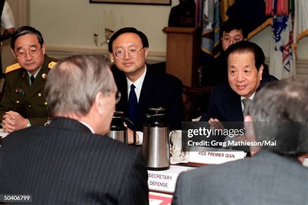 Secretary of Defense Donald H. Rumsfeld ) and Deputy Secretary of Defense Paul Wolfowitz meeting w. Chinese Vice Premier Qian Qichen , at the...