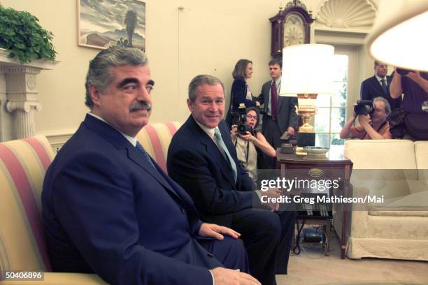 Prime Minister of Lebanon Rafik Hariri meeting w. President George W. Bush in the Oval Office of the White House.