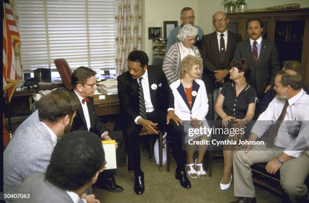 Black Leader Rev. Jesse L. Jackson with two sisters of hostage Rev. Lawrence M. Jenco, Sue Franceschini and Meg Mihelich and sister of hostage Terry...