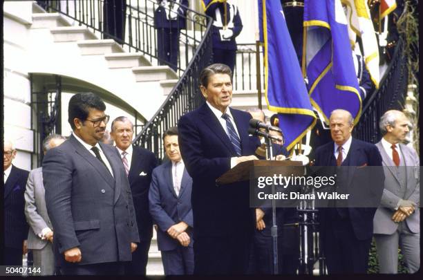 President Ronald W. Reagan with Turkish Prime Minister Turgut Ozal at White House with, rear, State Secretary George P. Shultz , Defense Secretary...