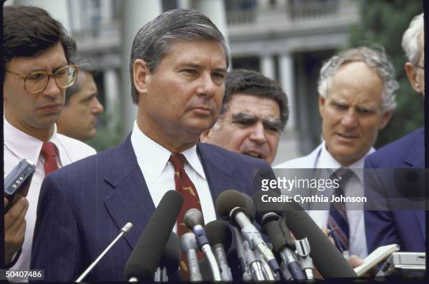 Senator Robert Graham speaking with reporters after a White House meeting.