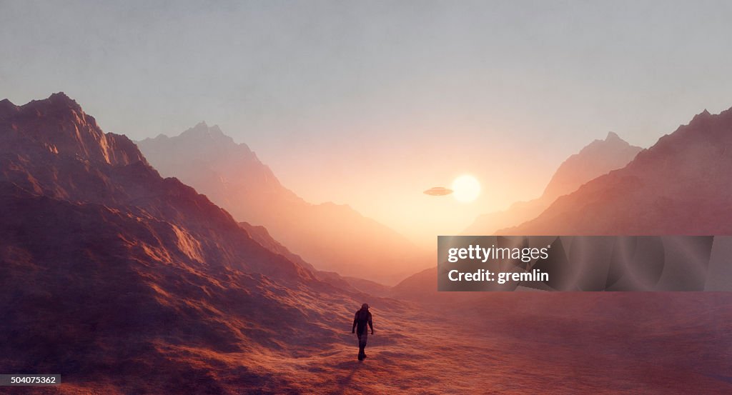 Astronaut walking on Mars, UFO flying