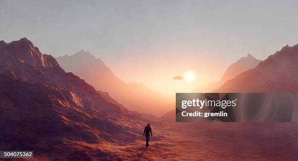 astronaut walking on mars, ufo flying - solitude mountain stock pictures, royalty-free photos & images