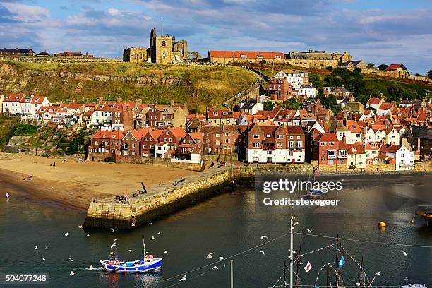 whitby  church, town,  abbey, harbour wall and beach - whitby stock pictures, royalty-free photos & images