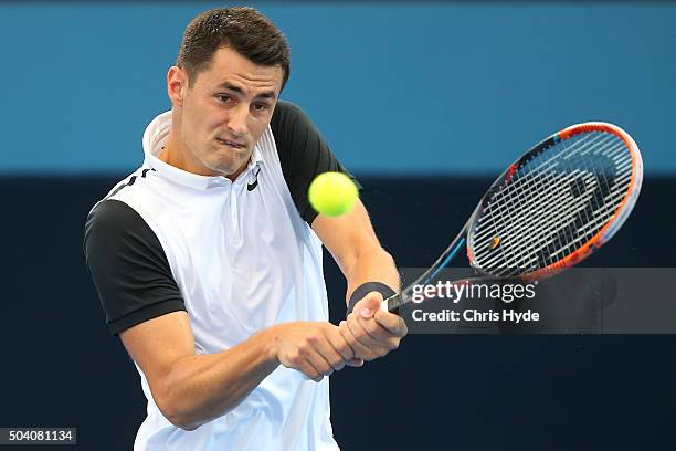 Bernard Tomic of Australia plays a backhand in his semi final match against Milos Raonic of Canada during day seven of the 2016 Brisbane...