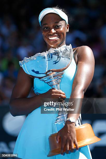 Sloane Stephens of the USA poses with the trophy after winning her singles final match against Julia Joerges of Germany during day six of the 2016...