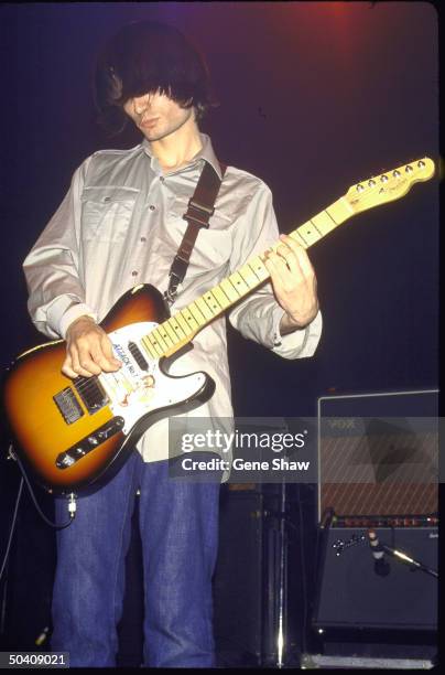 Guitarist Jonny Greenwood of Radiohead performing on stage.