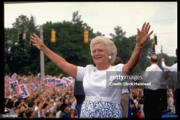 First Lady Barbara Bush waving to crowd at campaign rally.
