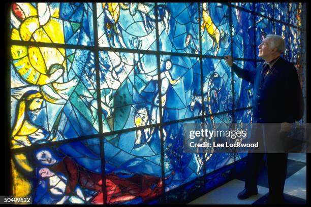 Artist Marc Chagall viewing his stained glass window installed at the United Nations.