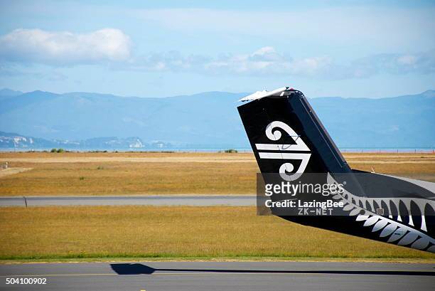 air new zealand all blacks theme livery aeroplane tail - flying kiwi stock pictures, royalty-free photos & images