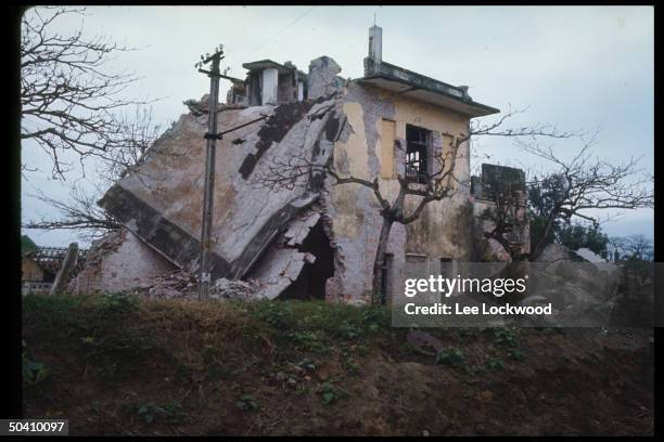 Bombed house at road junction in Phu Ly, North Vietnam countryside below Hanoi.