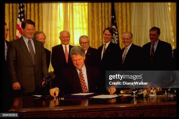 Pres. Bill Clinton signing Congressional Accountability Bill in White House Oval Office .