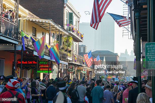 bourbon street crowd during mardi gras - new orleans people stock pictures, royalty-free photos & images