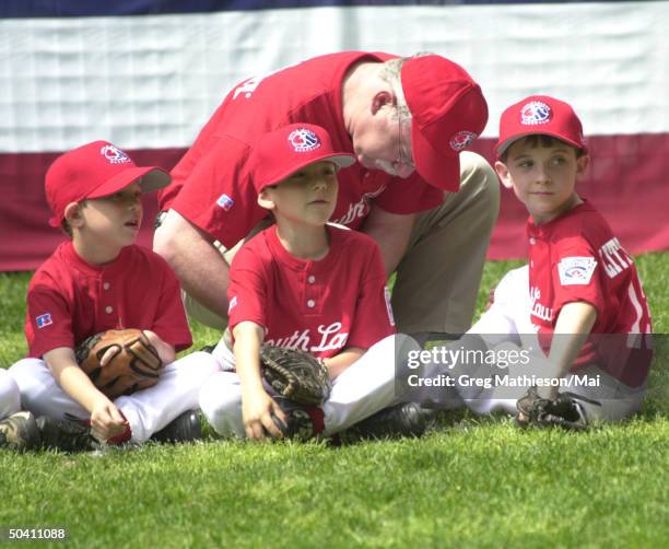 Unident. Little League team members of Memphis Red Sox watching team mates at bat during tee ball game on South Lawn of White House w. Their unident....