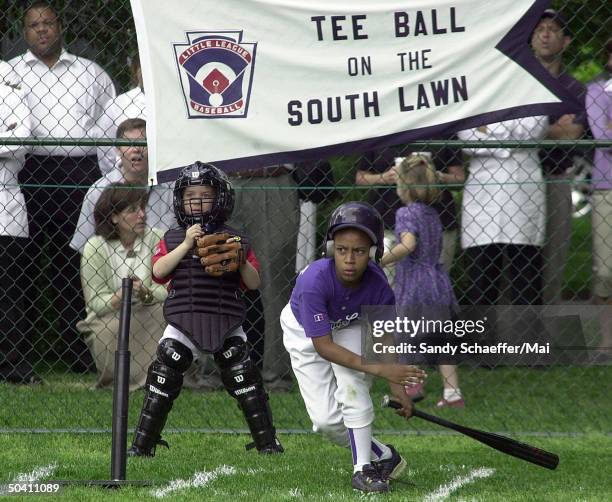 Unident. Little league team member of Capitol City Rockies up at bat at tee ball game played on South Lawn at White House.