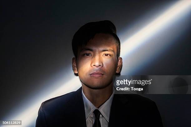 professional man with diagonal light across face - professional portrait ストックフォトと画像