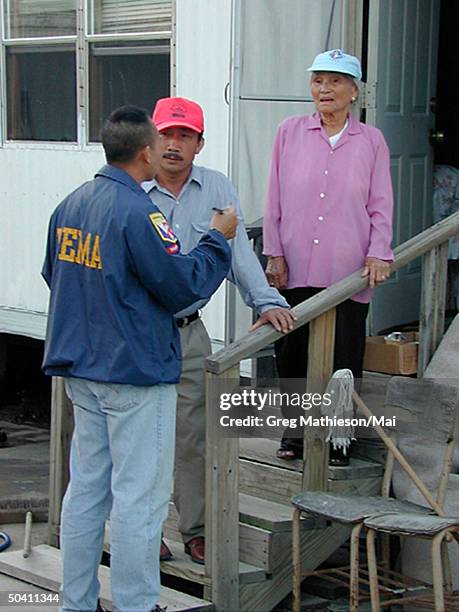 Representative Peter Vien talking w. Fatima Village community leader Tran Huong and resident Ky Nham about disaster assistance in wake of devastating...