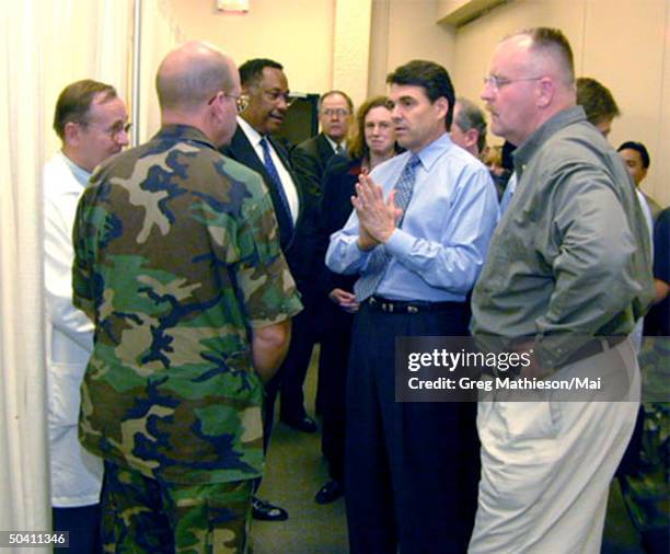 Director Joe Allbaugh and Texas governor Rick Perry touring the EMEDS field hospital operated at the Astrodome by the 59th Medical Unit fr. Wilford...