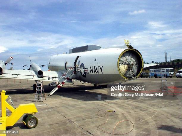 The fuselage of the U.S. Navy EP-3E Aries II aircraft awaiting further disassembly by the Lockheed Martin Aeronautics Co. Recovery team. The team...