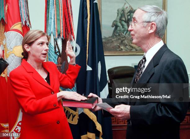Under Secretary of the Navy Susan M. Livingstone being sworn in by Secretary of the Navy Gordon R. England in ceremony in England's office at the...