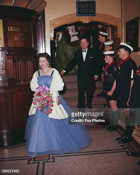 Queen Elizabeth II in the foyer of the Golders Green Empire, where she is attending a scout's Gang Show, London, 28th November 1962.