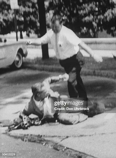 Unidentified man being kicked by police during Freedom Rider demonstrations.