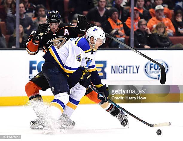 Ryan Kesler of the Anaheim Ducks attempts a move around Carl Gunnarsson of the St. Louis Blues during the third period at Honda Center on January 8,...
