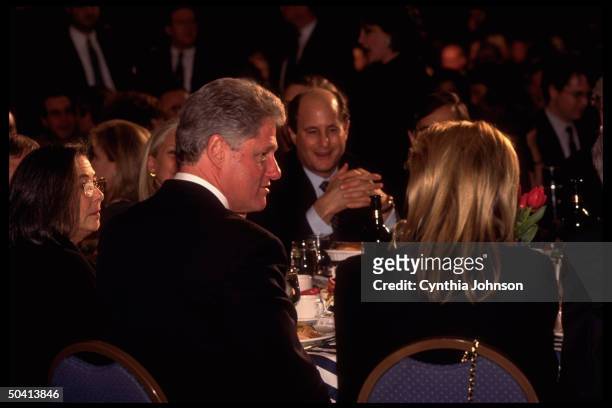Pres. Bill Clinton chatting up his table mates incl. Businessman Ron Perelman during fundraising event for his relection campaign.