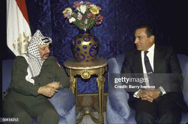 Egyptian Pres. Husni Mubarak meeting with Palestine Liberation Organization chairman Yasser Arafat.