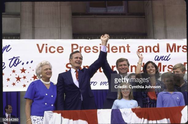 Presidential cadidate George H. W. Bush and his wife standing with GOP Vice Presidential candidate J. Danforth Quayle and his wife at a campaign...