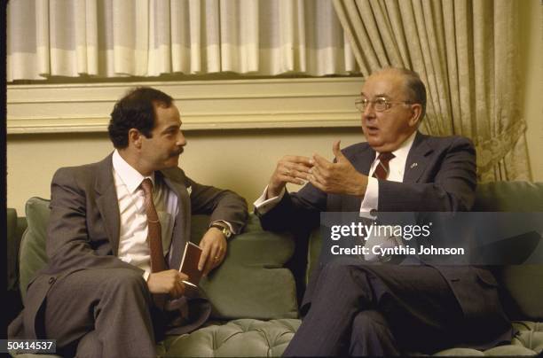 Republican Senator from North Carolina Jesse A. Helms sitting on couch with Time Correspondent Ted Gup for interview, in Helms' office.