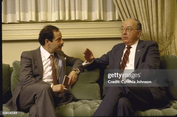 Republican Senator from North Carolina Jesse A. Helms sitting on couch with Time Correspondent Ted Gup for interview, in Helms' office.