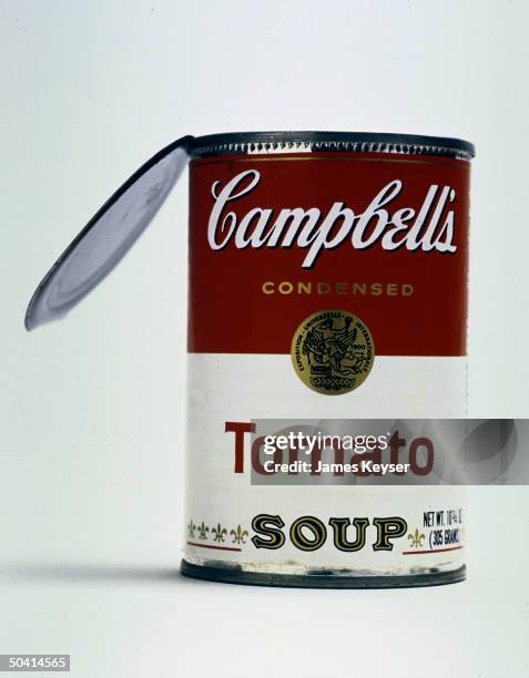 Closeup of Campbell's Tomato Soup can with open lid.