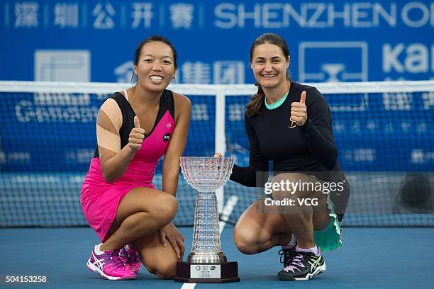 Vania King of USA and Monica Niculescu of Romania poses with the trophy after Women's doubles final match against Xu Yifan of China and Zheng Saisai...