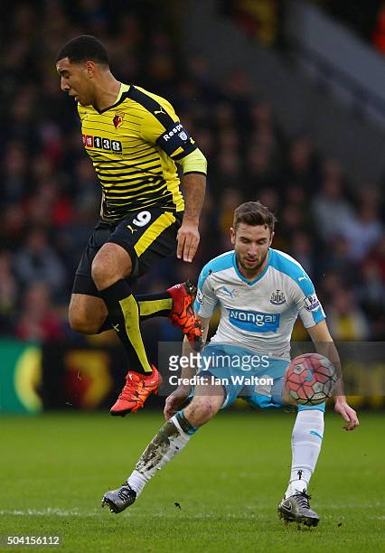 Troy Deeney of Watford and Paul Dummett of Newcastle United compete for the ball during the Emirates FA Cup Third Round match between Watford and...