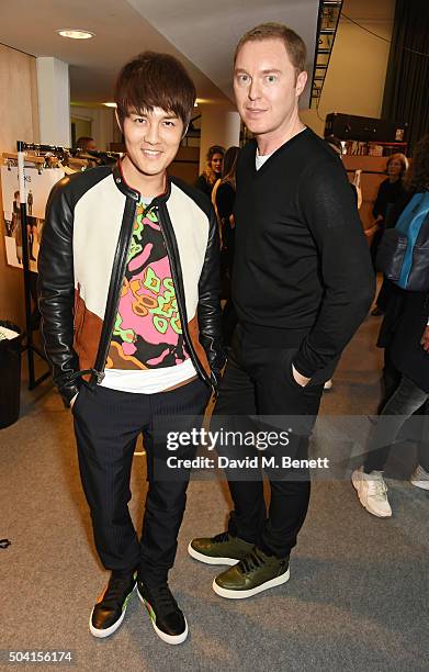 Kenji Wu and COACH Creative Director Stuart Vevers attend the Coach FW16 show front row during London Collections Men at The Lindley Hall on January...