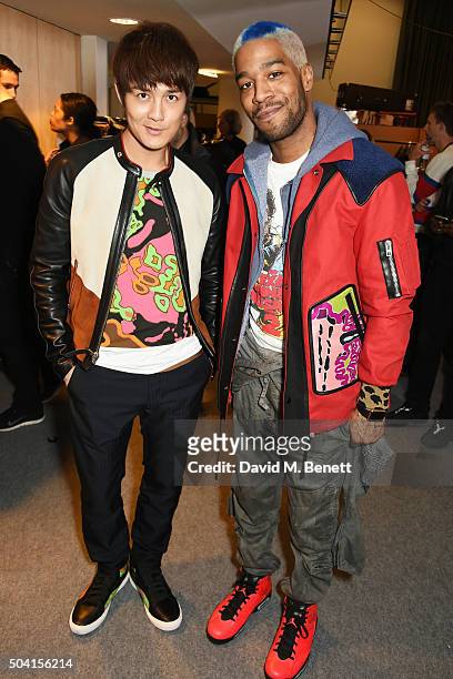 Kenji Wu and Kid Cudi attend the Coach FW16 show front row during London Collections Men at The Lindley Hall on January 9, 2016 in London, England.