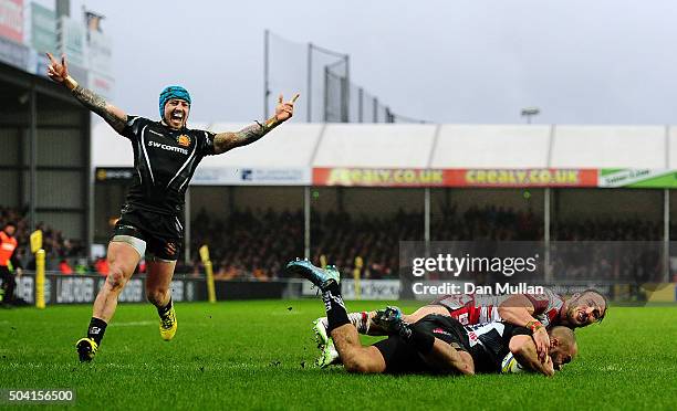 Olly Woodburn of Exeter Chiefs dives over for his side's third try as Jack Nowell of Exeter Chiefs celebrates during the Aviva Premiership match...