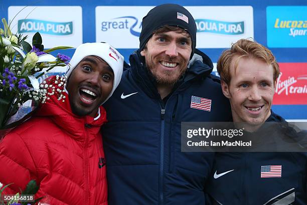 Mo Farah of Great Britain, Garret Hawkins of the United States and Scott Faubel of the United States pose on the podium after the Men's 8Km race...