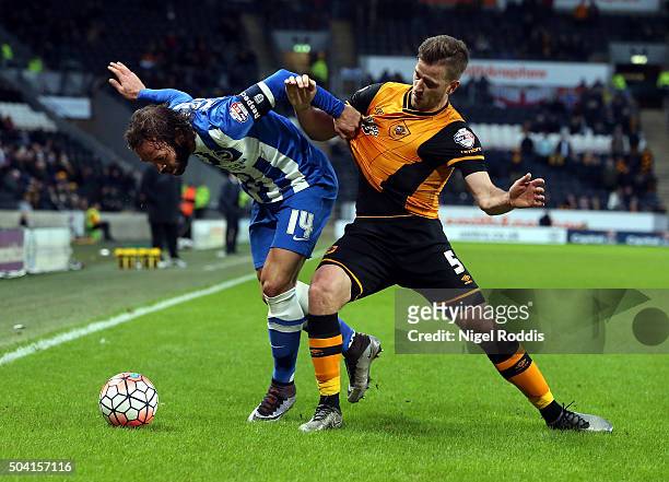 Ryan Taylor of Hull City challenges of Inigo Calderon of Brighton & Hove Albion during The Emirates FA Cup Third Round match between Hull City and...