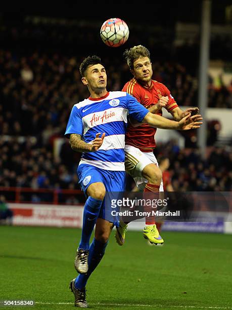 Jamie Ward of Nottingham Forest tackles Jamie Mackie of Queens Park Rangers during The Emirates FA Cup Third Round match between Nottingham Forest...