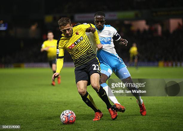 Almen Abdi of Watford and Moussa Sissoko of Newcastle United compete for the ball during the Emirates FA Cup Third Round match between Watford and...