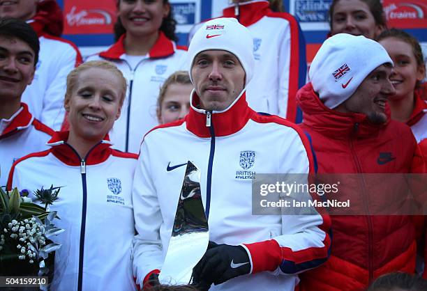 Ross Millington of Great Britain poses with the over all trophy during the Great Edinburgh X Country in Holyrood Park on January 09, 2016 in...