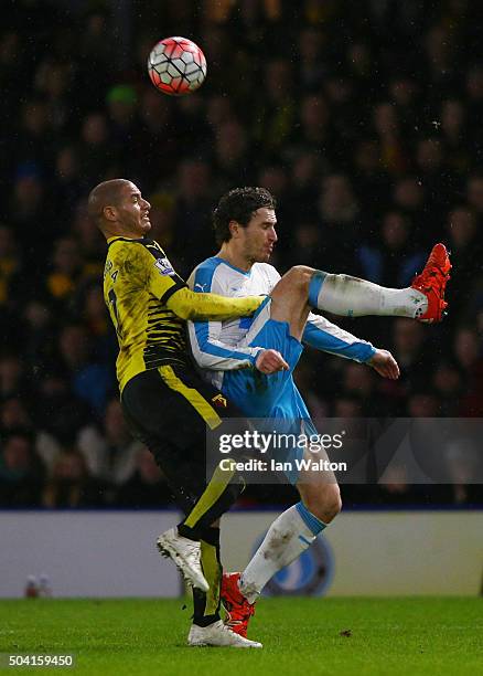 Daryl Janmaat of Newcastle United and Adlene Guedioura of Watford compete for the ball during the Emirates FA Cup Third Round match between Watford...