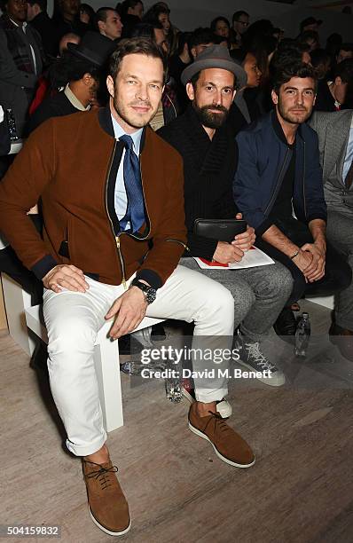 Paul Sculfor, guest and Robert Konjic attend the Oliver Spencer front row during London Collections Men AW16 at 180 The Strand on January 9, 2016 in...