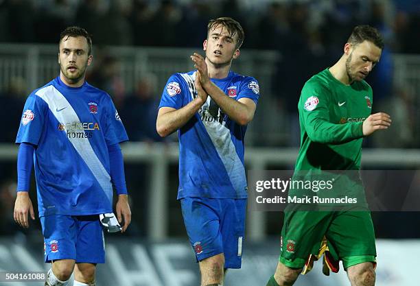 Jordan Richards, Rhys Oates and Trevor Carson of Hartlepool United walk from the pitch after their side lost to Derby County 2-1 during The Emirates...