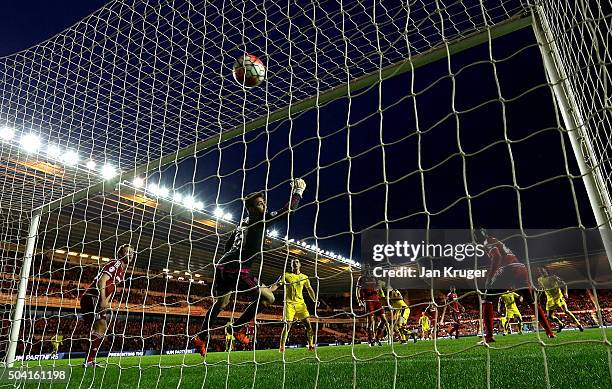 Stephen Ward of Burnley shoots past Tomas Meijias, Goalkeeper of Middlesbrough for the winning goal during the Emirates FA Cup third round match...