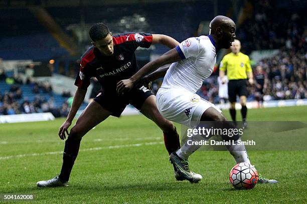 Souleymane Doukara of Leeds United FC maintains possession over Brandon Barker of Rotherham United FC during The Emirates FA Cup Third Round match...