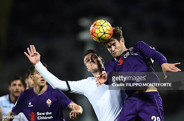 Fiorentina's defender from Spain Marcos Alonso Mendoza vies with Lazio's midfielder from Serbia Sergej Milinkovic-Savic during the Italian Serie A...
